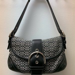 A mini Coach shoulder purse